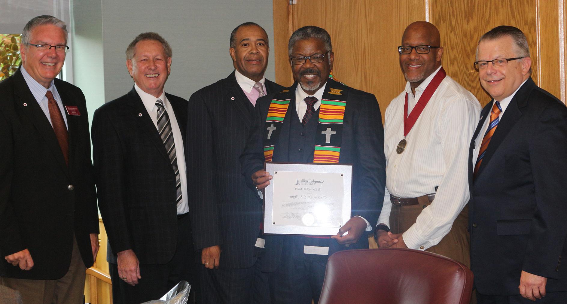 Campbellsville University's Kente Cloth award was presented to Dr. C.B. Akins, Sr., pastor of First Baptist Church Bracktown in Lexington, Ky. and moderator of the General Association of Baptists in Kentucky, for his servant leadership. From left: Dr. John Chowning, vice president for Church and External Relations and executive assistant to the president; Dr. Stephen J. Thurston, senior pastor of New Covenant Missionary Baptist Church in Chicago, Ill.; Akins; Dr. Joseph Owens, chair of CU's Board of Trustees; Dr. Frank Cheatham, senior vice president for Academic Affairs; and Dr. Keith Spears, vice president for Graduate and Professional Studies. (Campbellsville University Photo by Drew Tucker)