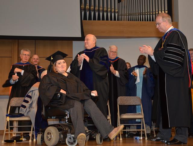 Brandi Wright of Campbellsville receives a standing ovation at Campbellsville University's  Commencement during which 216 students received degrees in two ceremonies in Ransdell Chapel. She received a bachelor of science degree in business administration in management. (Campbellsville University Photo by Joan C. McKinney)