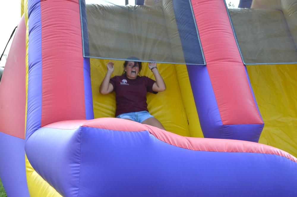 Annie Schakat had a wild times on the blow-up slide. (Campbellsville University photo by Drew Tucker)