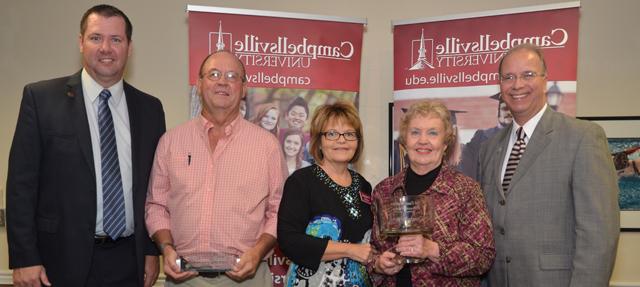 Pat Cave Webster, second from left, and Ronnie Hord, fourth from left, received Distinguished  Alumna and Alumnus Awards, respectively, at Homecoming. From left are Dr. Michael V. Carter, president; Webster; Paula Smith, director of alumni relations; Hord and Benji Kelly, vice president for development. (Campbellsville University Photo by Joan C. McKinney)