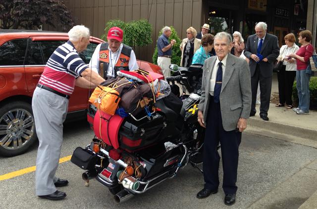 Dr. E. Bruce Heilman, center,  met with supporters at Cracker Barrel in LaGrange, Ky., as he  began his 10,000-mile journey by Harley-Davidson to Alaska. The Rev. Robert Oldham, a CU  graduate with Heilman, is at left wishing him well.