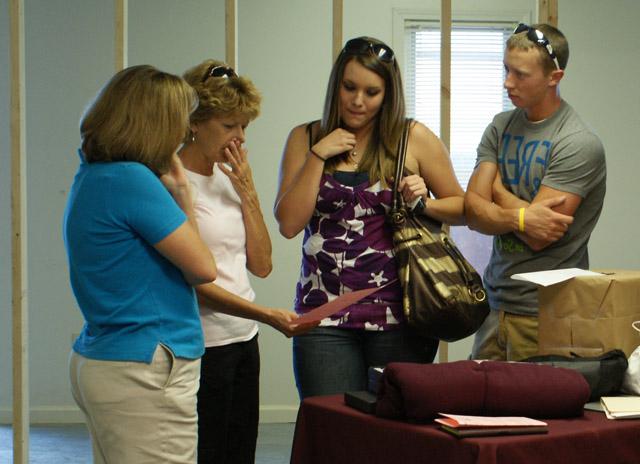 Matt Scott of Rineyville, Ali Richardson of Elizabethtown and her mom Suzy McFadden of Elizabethtown picked up info from Teresa Elmore, Director of Career Services. Richardson is a psychology major at CU and was checking out the possibility of taking classes closer to home. (Photo Courtesty of Linda Ireland, LaRue County Herald News) 