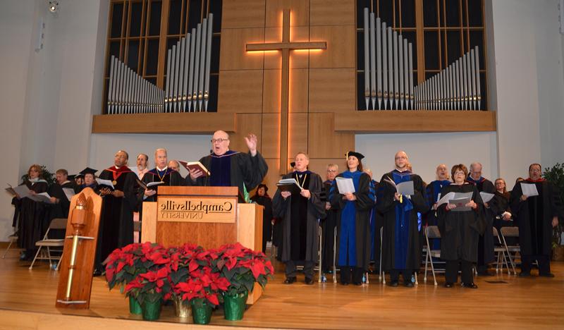 Dr. C. Mark Bradley, professor of music, leads the music during both commencements. (Campbellsville University Photo by Joan C. McKinney)