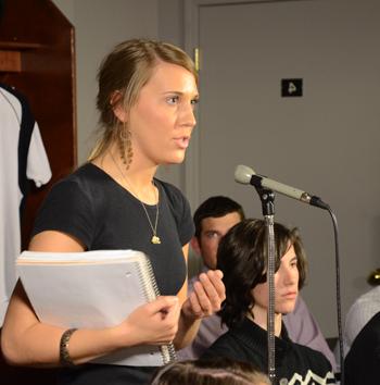 Lacy Mudd of Campbellsville, a student in copyediting at Campbellsville University, asks a question about what constitutes child abuse at the press conference. (Camp- bellsville University Photo by Joan C. McKinney)