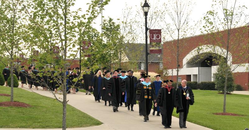 Master's graduates march into Ransdell Chapel as they continue the annual Senior Walk. (Campbellsville University Photo by Linda Waggener)