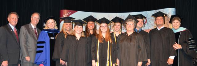 The P-12, elementary education students pinned from left are: from left: Front row —Jo Ann Harris, Abby Lanham and Anne Russell Blevins. Back row -Dr. Brenda Priddy, Trevor Ervin, Joe Gupton, Lindsey Harrod, Aubrey Skutt and Bobby Jo Sturm with Dr. Donna Hedgepath, Dr. Michael V. Carter and Dr. Frank Cheatham. (Campbellsville University Photo by Joan C. McKinney)