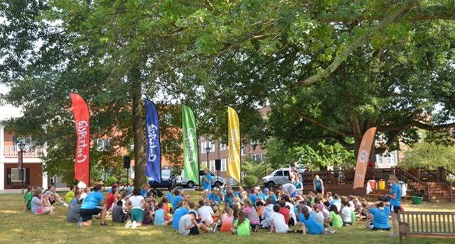 Rachel Gillespie of Maryville, Tenn. leads the 100 campers on the Campbellsville University  campus in motivational exercises. The Centri-Kid campers are visiting from throughout  Kentucky, Illinois and Tennessee. (Campbellsville University Photo by Joan C. McKinney)