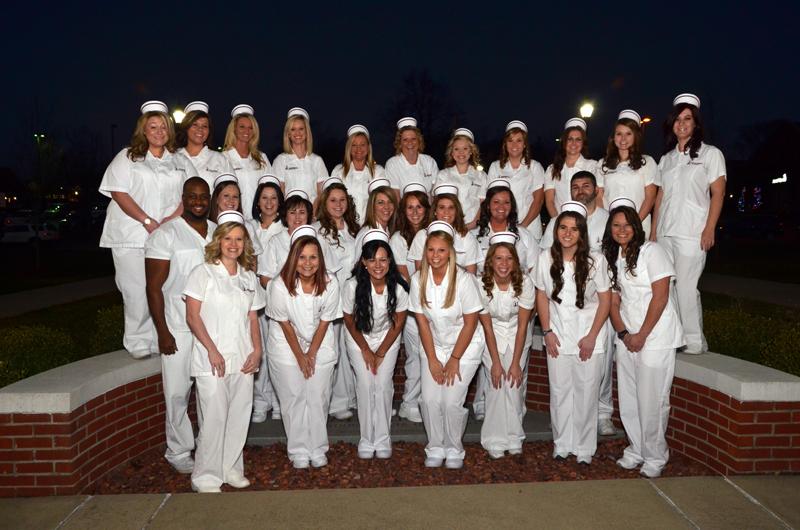  Campbellsville University School of Nursing students who were pinning in a ceremony Dec. 11 include from left: Front row -- Sarah Tanaka of Campbellsville, Ky.; Rachel Smith of Louisville, Ky.; Sarah Apedaile of Hendersonville, Tenn.; Jacklyn Wahl of Liberty, Ky.; Cheyenne Gettings of Greensburg, Ky.; Jeannie Lyons of Liberty, Ky.; and Carla Mattingly of Lebanon, Ky. Second row – Alex Montgomery of Campbellsville, Ky.; Tonya Kessler of Campbellsville, Ky.; Erin Clarkson of Bonita Springs, Fla.; Emilee York of Liberty, Ky.; Lara Bland of Campbellsville, Ky.; Jessica Cross of Russell Springs, Ky.; Melinda Osborne of Elkhorn, Ky.; Katie Watson of Campbellsville, Ky.; Jesslyn Kelsey of Stanford, Ky. and Thomas Singleton of Campbellsville, Ky. Back row – Renee Bell of Campbellsville, Ky.; Bethany Gusler of Sonora, Ky.; Hillary Hutchison of Columbia, Ky.; Kisha Miller of Russell Springs, Ky.; Mackenzie Gentry of Greensburg, Ky.; Barbara McGuffin of Albany, Ky.; Deborah Sullivan of Campbellsville, Ky.; Madison Walls of Lebanon, Ky.; Emily Taylor of Liberty, Ky.; Brittany Grant of Glasgow, Ky., and Patricia Tupman of Columbia, Ky. (Campbellsville University Photo by Joan C. McKinney)