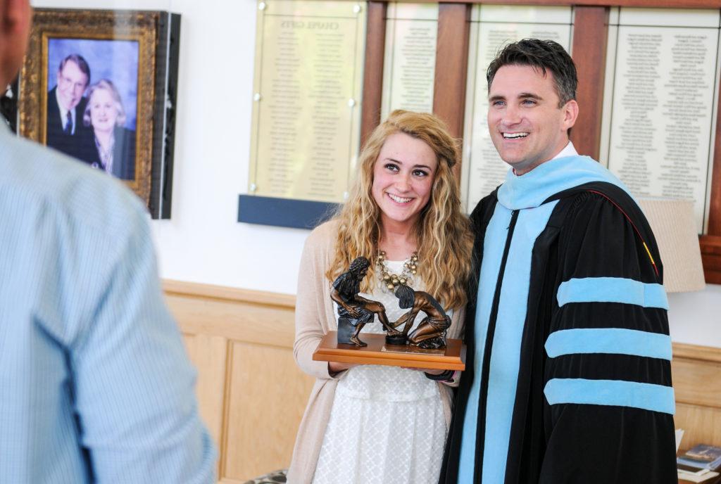 From left, Dr. Shane Garrison, vice president for enrollment services, and Rachel Mobley of Elizabethtown, Ky., take a photo together after the Honors and Awards Day at Campbellsville University. (Campbellsville University Photo by Joshua Williams)