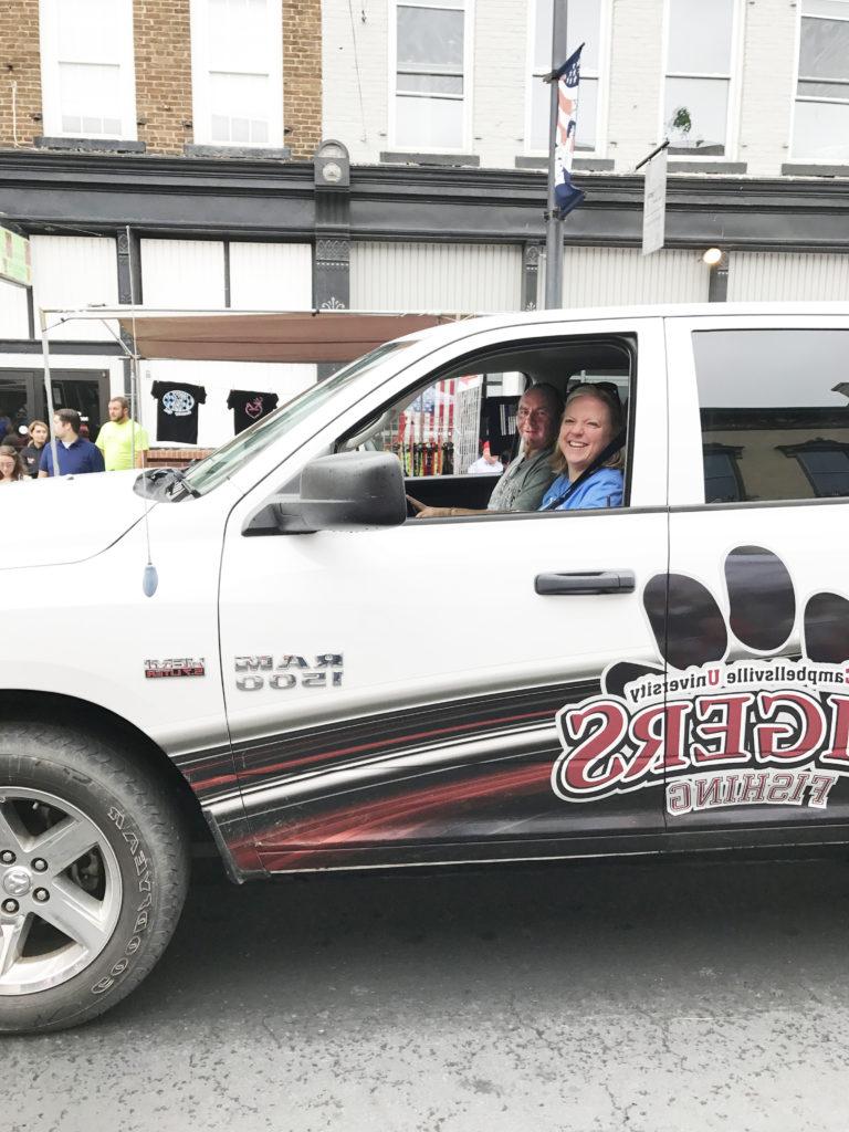 Dr. Donna Hedgepath, provost and vice president for academic affairs, appears in the parade in a truck driven by her husband, Pete Hedgepath, assistant bass fishing coach at Campbellsville University. (Campbellsville University Photo by Joan C. McKinney)